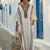 Noemi | Vestido maxi de escote en V, manga corta y con bolsillos